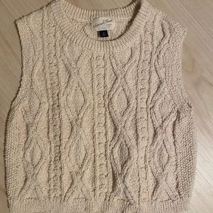 Sweater. Sleeveless. Neutral.